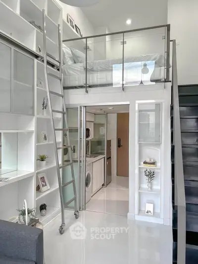 Modern loft apartment with mezzanine, sleek design, and built-in storage solutions.