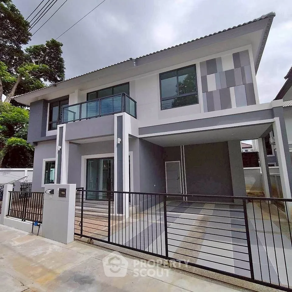 Modern two-story house with sleek design and spacious driveway