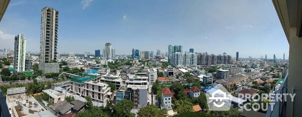 Stunning panoramic cityscape view from high-rise balcony in vibrant urban area