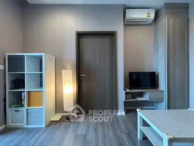Modern living room with sleek furniture and air conditioning, perfect for comfortable urban living.