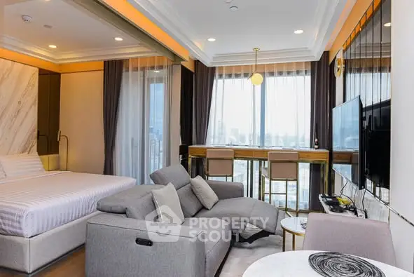 Luxurious modern studio with panoramic city view, featuring stylish furniture and open layout.