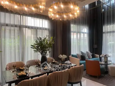 Luxurious dining and living area with elegant lighting and modern decor