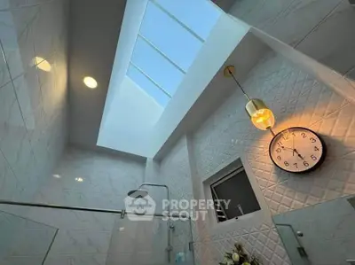 Luxurious bathroom with skylight and modern shower design