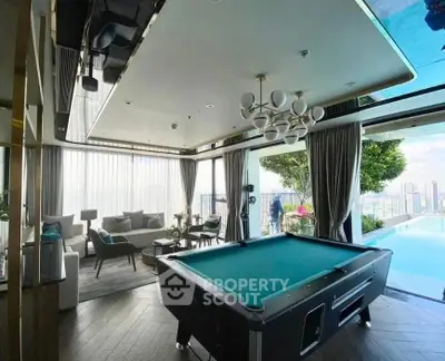 Modern living room with large windows and stylish ceiling design