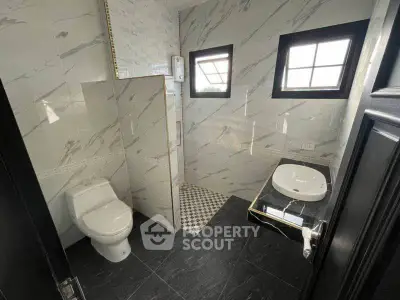 Modern bathroom with elegant marble tiles and sleek fixtures