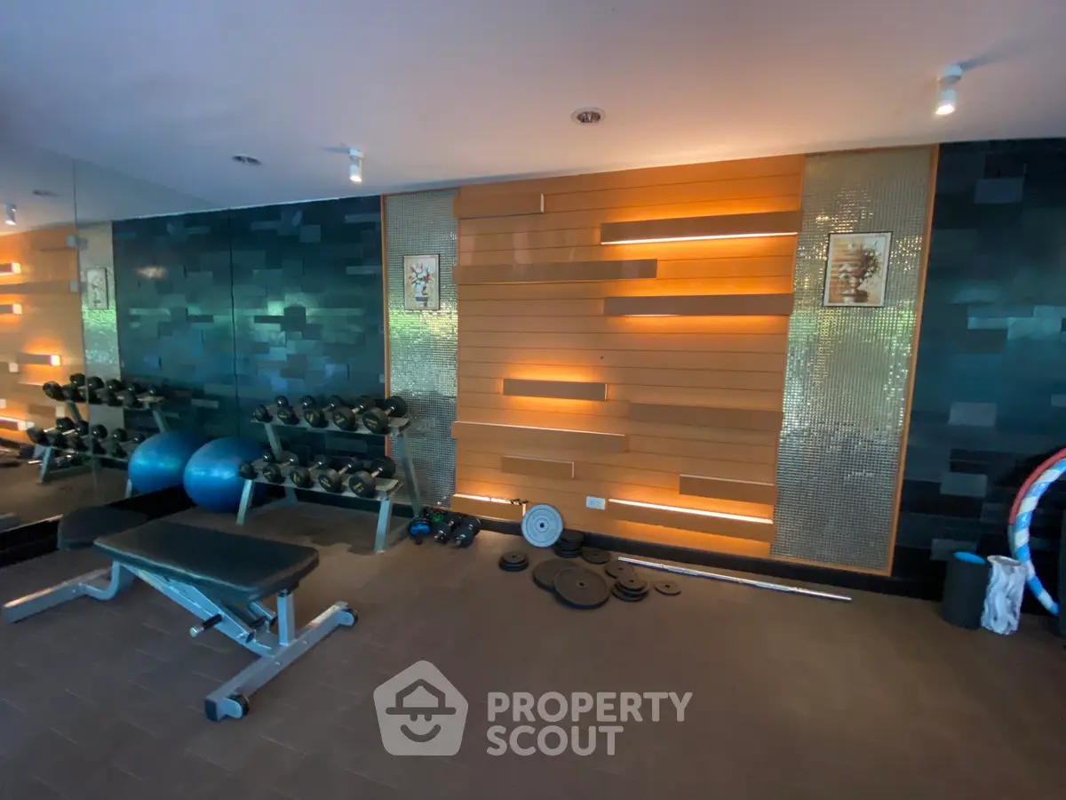 Modern home gym with stylish wall design and fitness equipment