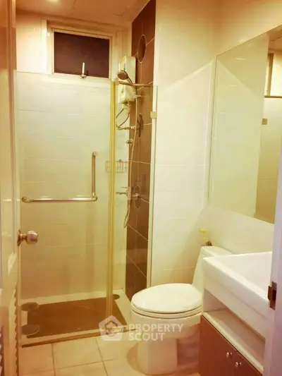 Modern bathroom with glass shower and sleek fixtures