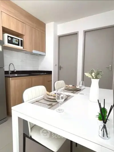 Modern kitchen with sleek dining area and wooden cabinetry