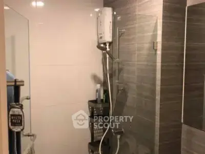 Modern bathroom with sleek shower design and contemporary fixtures.