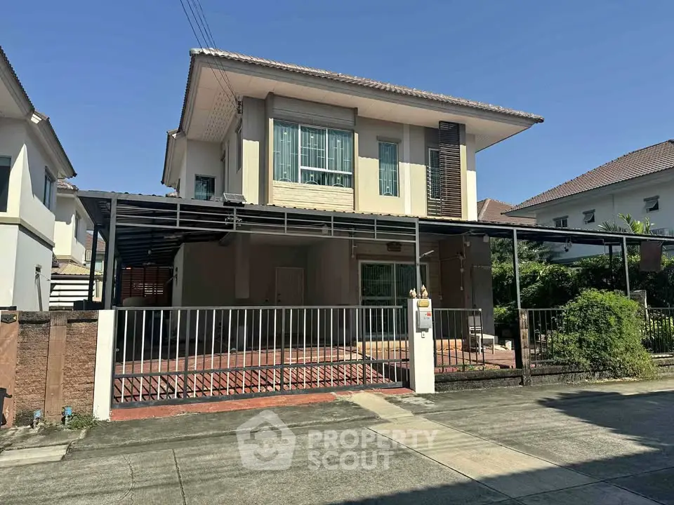 Charming two-story house with modern design and spacious driveway in a serene neighborhood.