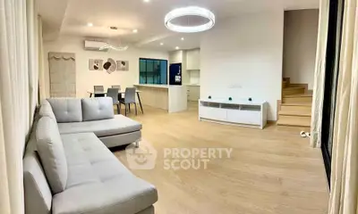 Spacious modern living room with open kitchen and stylish decor