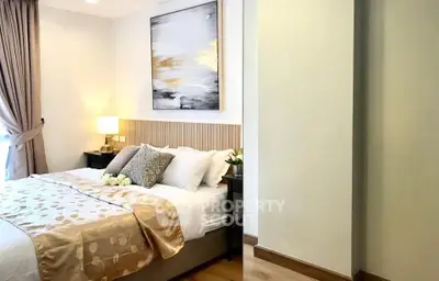 Elegant bedroom with modern decor and cozy ambiance, featuring a stylish bed and soft lighting.