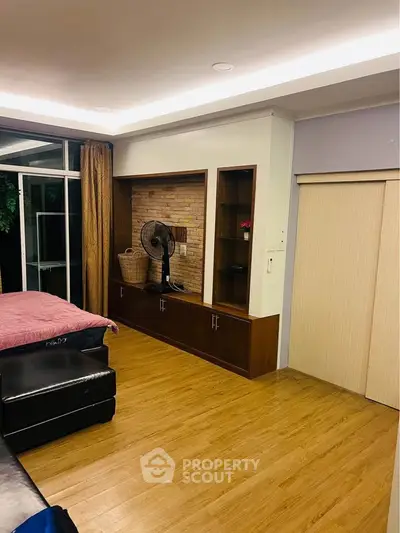 Spacious living room with wooden flooring and modern decor