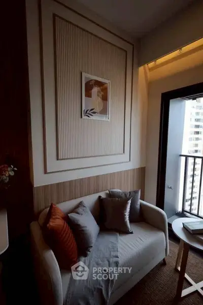 Cozy living room with modern decor and balcony access in urban apartment