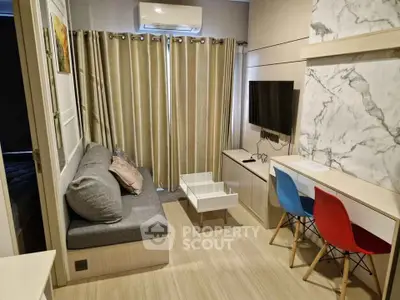 Modern living room with stylish decor and wall-mounted TV