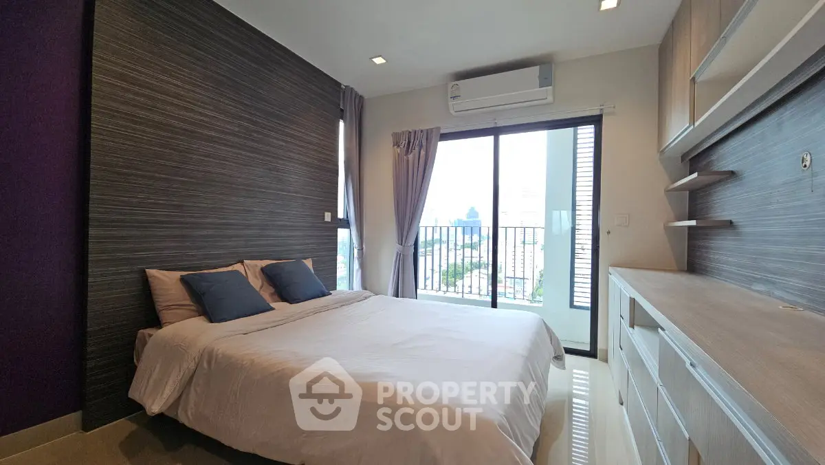 Modern bedroom with balcony view in a stylish apartment