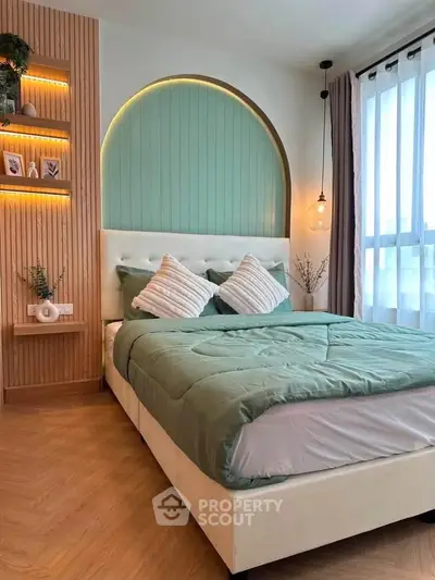 Modern bedroom with stylish decor, featuring a cozy bed, elegant lighting, and wooden accents for a serene ambiance.