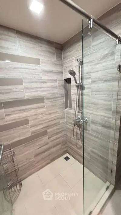 Modern bathroom with sleek glass shower and stylish tile design