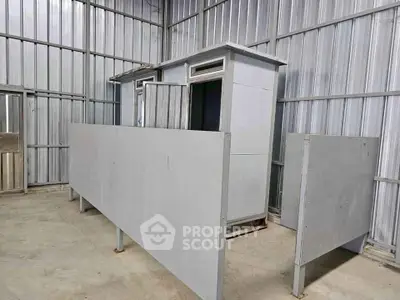 Industrial storage unit with metal walls and partitioned sections