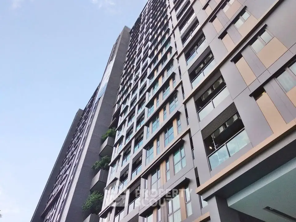 Modern high-rise building with sleek design and large windows