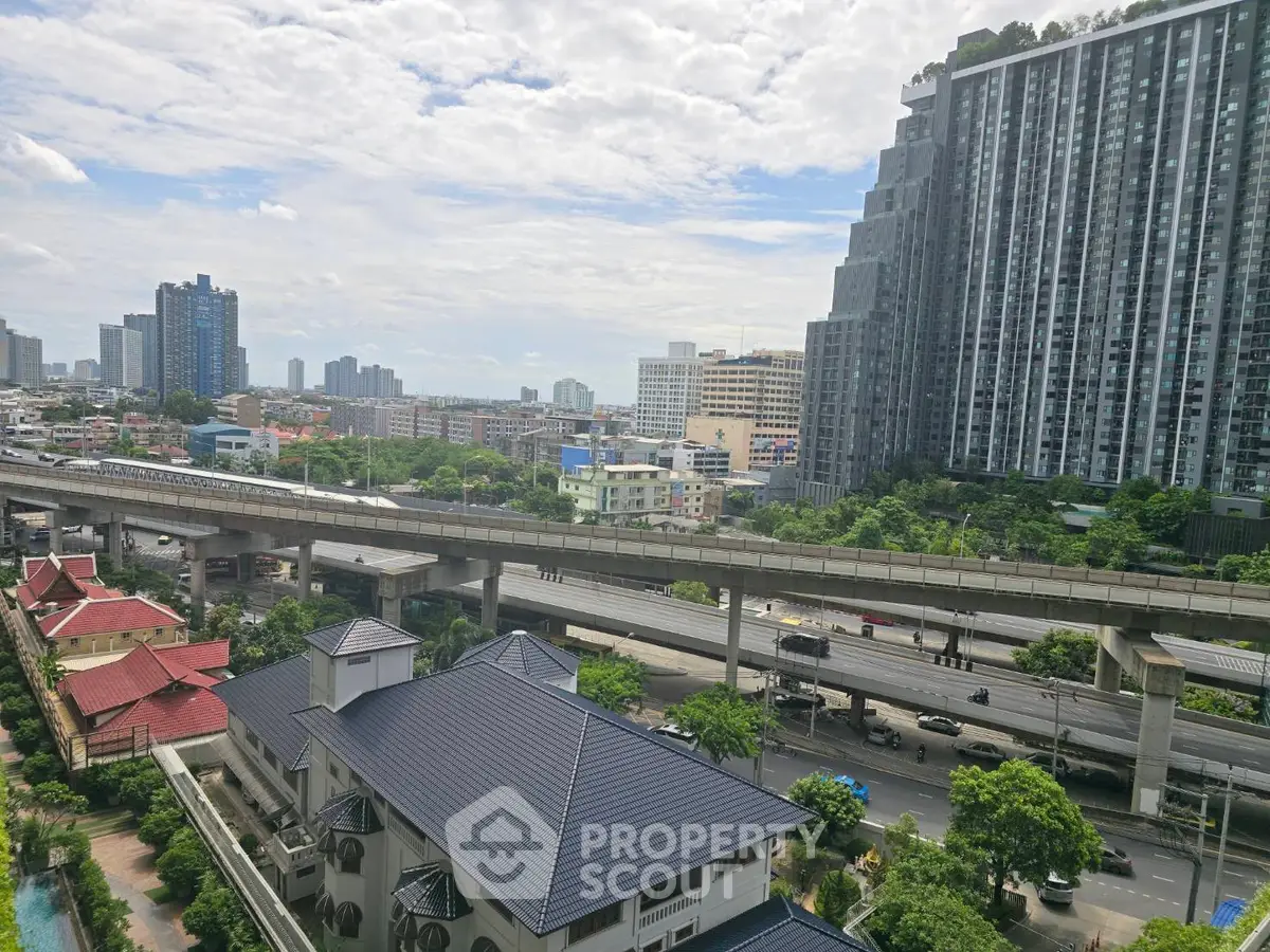 Stunning cityscape view with modern high-rise buildings and lush greenery, perfect for urban living.