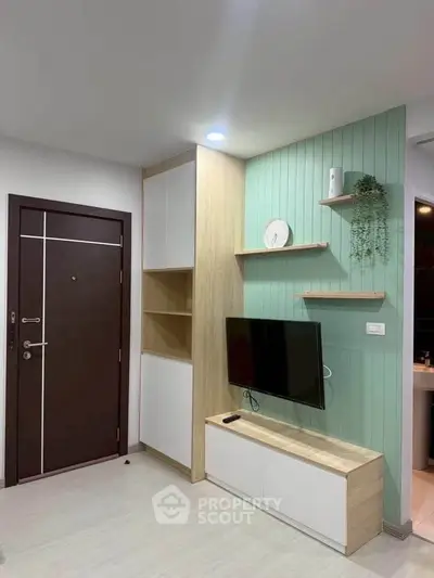 Modern living room with stylish TV setup and wooden accents
