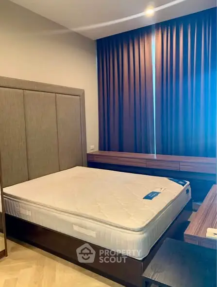 Modern bedroom with elegant design, featuring a comfortable bed and stylish furniture, perfect for relaxation.