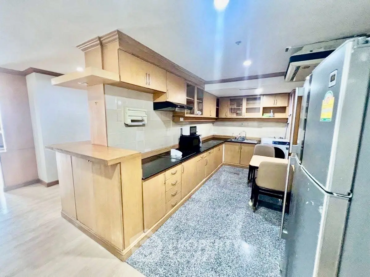 Spacious kitchen with modern appliances and ample storage in a stylish home