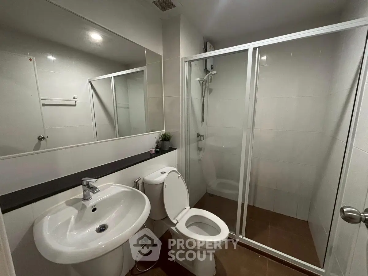 Modern bathroom with glass shower and sleek fixtures