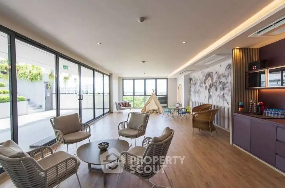 Spacious modern living room with large windows and garden view