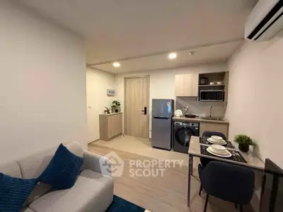 Modern compact apartment with cozy living area and functional kitchen