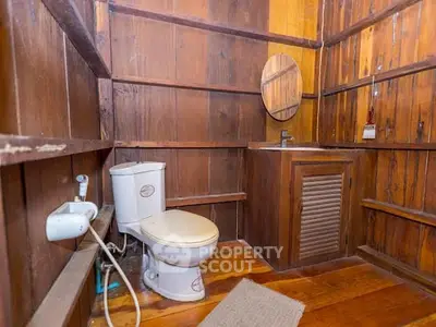 Rustic wooden bathroom with unique design and cozy ambiance