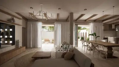 Spacious living room with modern decor and open layout leading to a serene garden view.