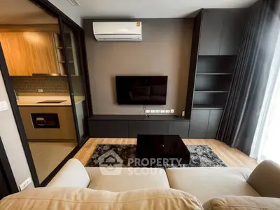 Modern living room with sleek design and open kitchen view