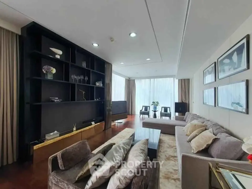 Luxurious living room with elegant decor and large windows offering natural light