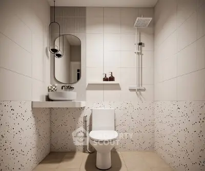 Modern bathroom with stylish fixtures and terrazzo tiles, featuring a sleek shower and elegant mirror.