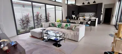 Spacious modern living room with open kitchen and large windows