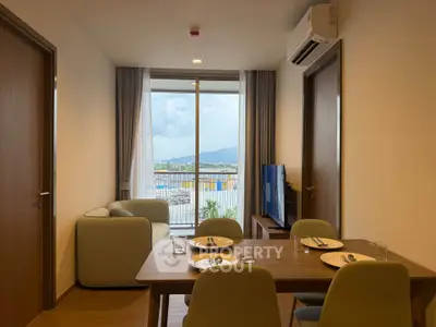 Modern living room with dining area and balcony view in stylish apartment