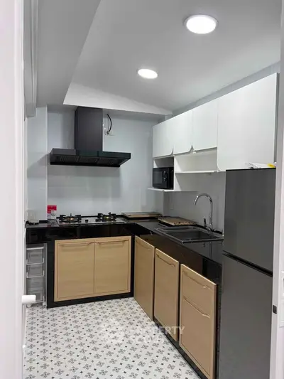 Modern kitchen with sleek cabinets and gas stove in a stylish apartment