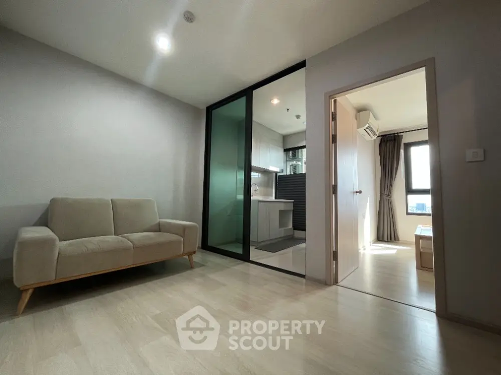 Modern apartment interior with cozy living room and sleek kitchen design