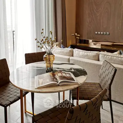 Elegant modern living room with stylish dining area and chic decor