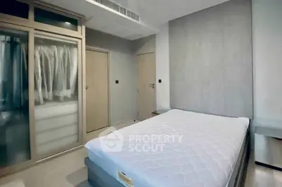 Modern bedroom with sleek wardrobe and minimalist design