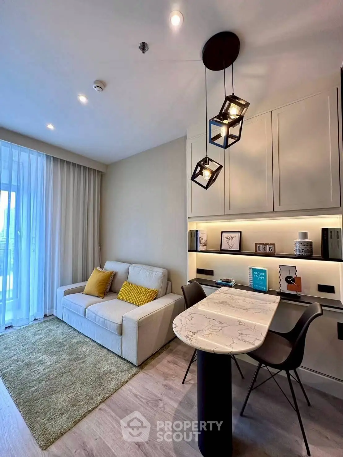 Modern living room with stylish lighting and cozy seating area