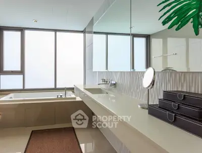 Luxurious modern bathroom with large windows and elegant fixtures