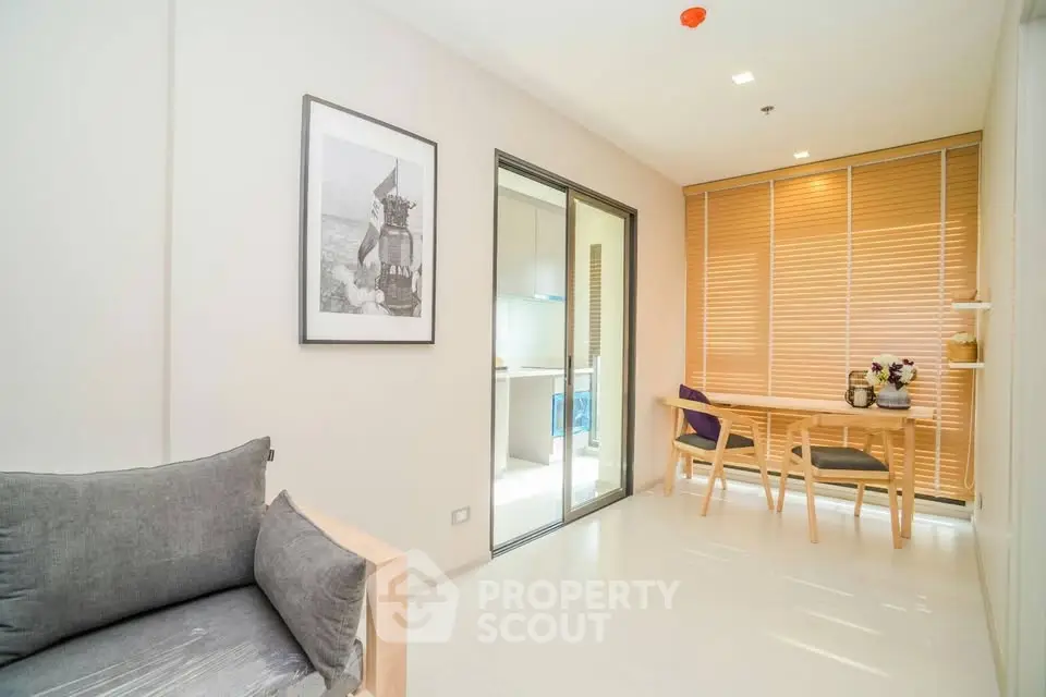 Modern living room with natural light and stylish decor in a cozy apartment.