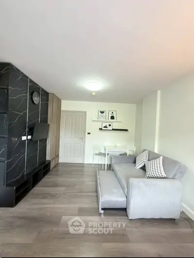 Modern living room with stylish decor and comfortable seating in a contemporary apartment.
