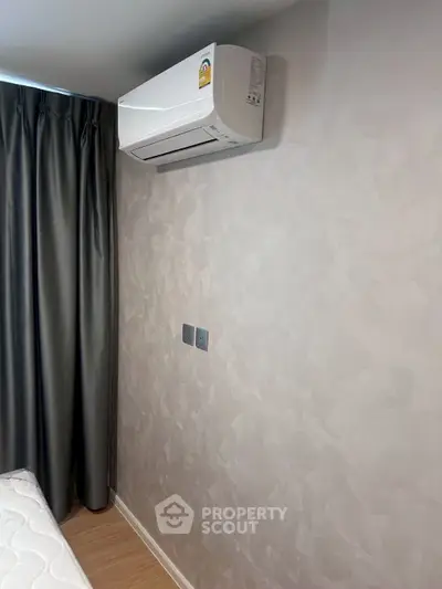 Modern bedroom with air conditioning and elegant curtains