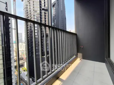 Modern urban balcony with city skyline view, perfect for relaxation and enjoying the vibrant city life.