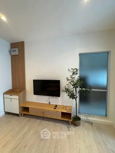 Modern living room with sleek TV setup and stylish decor