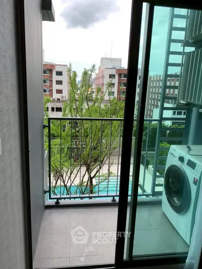 Modern balcony with washing machine and city view